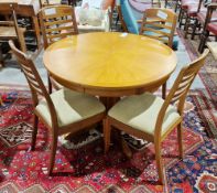 Mid century Nathan Shades teak extending dining table, the ciruclar top with sun burst veneer