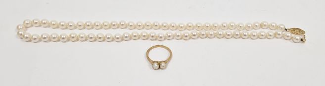 Single strand cultivated pearl necklace, the 64 pearls of similar size, on a 14k yellow gold