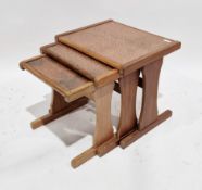Mid-century G-Plan teak nest of three tables, all with hammered copper inlaid tops, on shaped