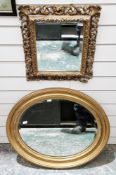 19th century giltwood framed rectangular wall mirror, the pierced frame carved with foliate scrolls,