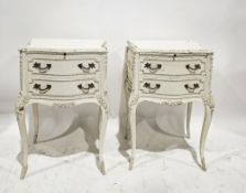 Pair of mid-century French bedside cabinets of serpentine form, in the Louis XVI manner with a white