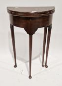 19th century mahogany fold-over tea table in the manner of George II, of demi-lune form, on turned
