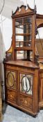 Edwardian rosewood inlaid corner cabinet having bevel edged astragal-glazed doors, the upper section