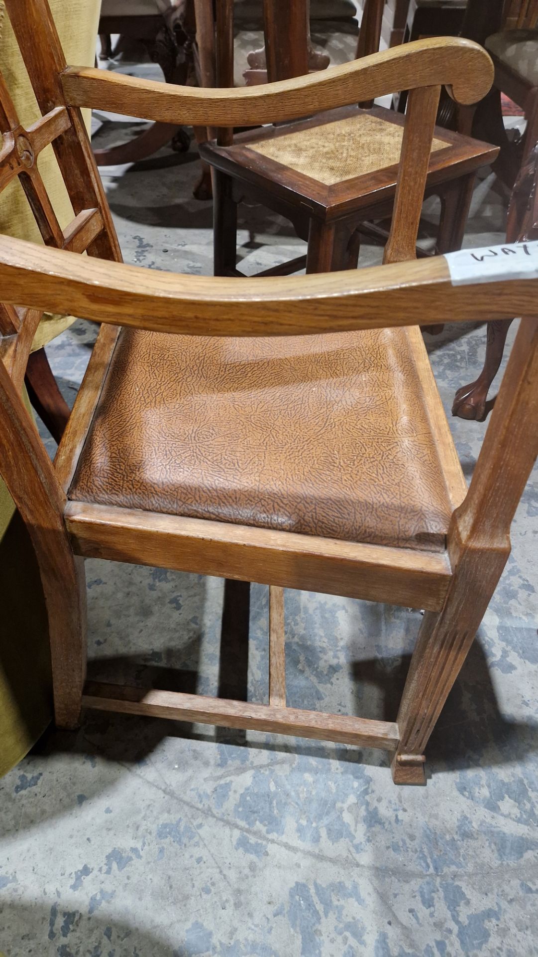 In the manner of the Cotswold School an Arts and Crafts pale oak elbow chair with lattice back, - Image 9 of 14