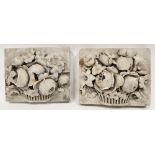 Pair of white marble carved relief plaques depicting flowers in a basket, each 22cm x 18cm