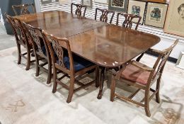 A mahogany twin pedestal dining table in the George lll manner, the rectangular top with rounded