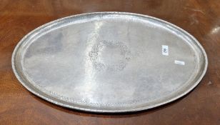 Arts and Crafts silver plated tray by Hugh Wallis, hand beaten, of oval form with a reeded edge