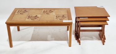 Mid-century Danish teak tile-top coffee table of rectangular form, on square legs, stamped 'Made