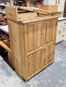 Exmoor Furniture pine quilting cupboard of metamorphic design, with two panelled doors, a folding