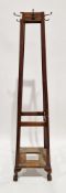 1920's/30's oak hall stand of square tapered form, comprising metal coathooks over a stickstand (