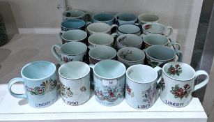 Collection of Adams, Poole Pottery, Masons ironstone year mugs produced for Liberty of London,