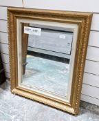 Early 20th century mirror, the rectangular plate in a gilt foliate scroll moulded frame, 70cm x 58cm