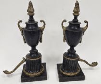 Pair of 19th century French bronze and ormolu mounted urns in the Empire manner, with cast flame