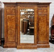 Victorian burr walnut breakfront compactum wardrobe, the moulded cornice over a central mirrored