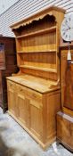 Pine dresser, the top with three plate shelves having hooks, the base with three frieze drawers over