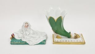 Vienna-style ram's head cornucopiae and a figure of a baby on a cushion, mid-19th century, impressed