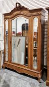 19th century French walnut wardrobe, the foliate scroll carved cresting on shaped moulded,