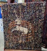 Modern wall-hanging tapestry with midnight blue ground, depicting the 'Unicorn in Captivity',