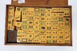 Mid century mah-jong set comprising approximately 152 butterscotch bakelite tiles, fitted in its