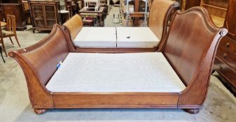 Frank Hudson mahogany kingsize sleigh bed, the headboard and footboard with scrolling ends and