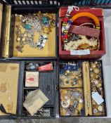 Three leather boxes and contents of costume jewellery including brooches, vintage orange paste