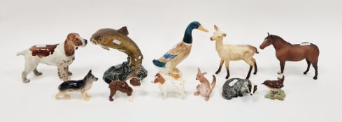 Various Beswick Pottery models of animals, including: dogs, a trout, a duck, a badger, a wren, a