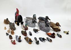 Collection of approximately twenty-two wooden painted models of ducks and birds, largest duck 26cm