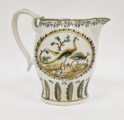 Early 19th century Prattware jug, moulded with peacocks, within landscape in oval stiff leaf moulded