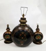 Large Indian Mughal style metal water bottle with floral decoration on a black ground, 57cm high