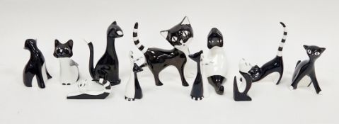 Group of Cmielow porcelain black and white models of stylised cats, printed red AS and printed black