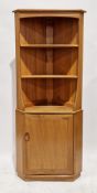 Ercol Windsor 743 light elm corner cupboard comprising two shelves over single panel door, 178cm