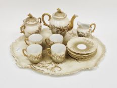 Limoges porcelain part coffee set, circa 1900, in two-tone gilding, printed green marks, pattern