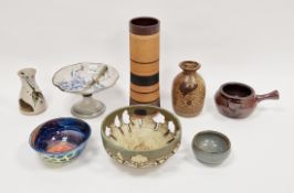 Quantity of studio pottery to include a Simon Rich tazza with floral decoration on cream ground,