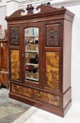Edwardian walnut and burr walnut wardrobe, the carved swan neck cornice over a single mirrored door,