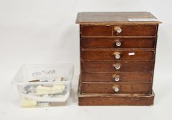 Early 20th century stained pine table top cabinet of six drawers, 42cm high x 38cm wide x 21cm