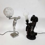 Two contemporary figural table lamps, one in the form of an Art Deco nude lady with glass globular