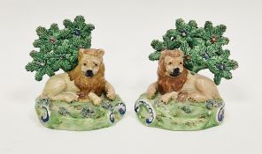 Pair of Walton pearlware models of lions, early 19th century, each modelled lying recumbent before