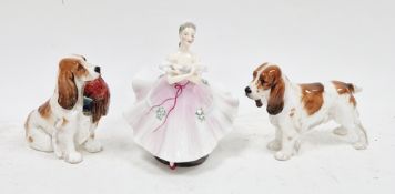 Two Royal Doulton bone china models of a cocker spaniel, comprising: a seated model with pheasant in