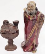 Chinese Yixing censer, 20th century, modelled as a seated Budai, supporting a stack of coins,