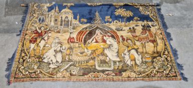 Four wall hangings including a Turkish blue and tan hanging decorated with a mihrab, 127cm wide,