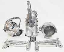 Three vintage chrome theatre spotlights, including Strand 123, Strand 23 and a Century together with