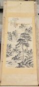 20th century Chinese scroll ink painting on silk, depicting pine trees in a mountainous landscape,
