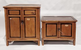 South East Asian hardwood cupboard, the two panel doors opening to two shelves and two drawers,