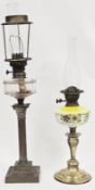 Two late 19th / early 20th century brass oil lamps, the first with clear glass well on a