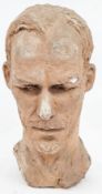 20th-century terracotta bust of a man with a textured surface, 41cm high