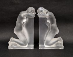 Pair of Lalique frosted glass Reverie bookends, etched Lalique France marks to one, each modelled as