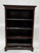 19th / early 20th-century mahogany bookcase, the moulded pediment over three shelves, on shaped