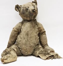 Early 20th century Steiff teddy bear, circa 1910, well loved, stitched nose, straw filled, back hump