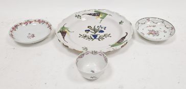 New Hall porcelain teabowl and two saucers, circa 1790, together with a French faience plate, late