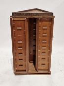 Early 20th century wooden shop display postcard stand, of triangular form rotating on a triangular